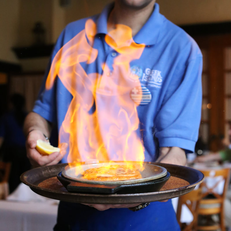 Photo of saganaki cheese on fire at Greek Islands in Chicago, IL. Taken by Melanie Richtman.