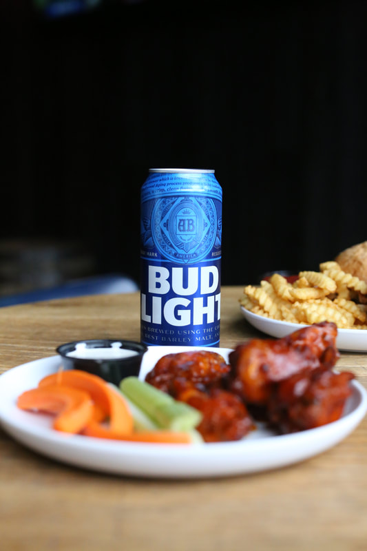 Photo of chicken wings and Bud Light at Brickhouse Tavern in Chicago, IL. Taken by Melanie Richtman.
